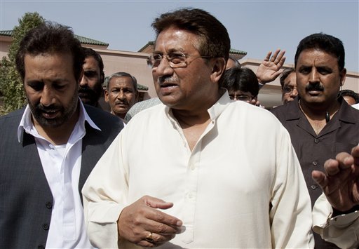 In this Monday, April 15, 2013 photo, Pakistan's former President and military ruler Pervez Musharraf arrives under tight security to address his party supporters at his house in Islamabad, Pakistan. Musharraf and his security team pushed past policemen and sped away from a court in the country’s capital on Thursday after his bail was revoked in a case in which he is accused of treason. (AP Photo/B.K. Bangash)