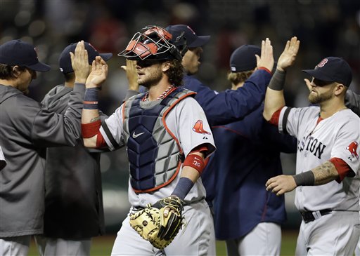 Boston Red Sox catcher Jarrod Saltalamacchia, center, celebrates with teammates after a 6-3 win over the Cleveland Indians in a baseball game Wednesday, April 17, 2013, in Cleveland. (AP Photo/Mark Duncan) Progressive Field
