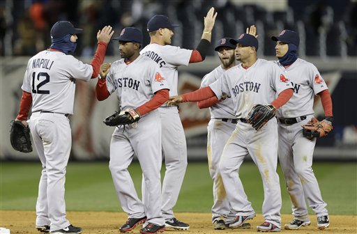 Boston Red Sox players celebrate their 7-4 win over the New York Yankees in a baseball game at Yankee Stadium in New York, Wednesday, April 3, 2013. From left are first baseman Mike Napoli (12), left fielder Jackie Bradley Jr., third baseman Will Middlebrooks, second baseman Dustin Pedroia, right fielder Shane Victorino and shortstop Jose Iglesias. (AP Photo/Kathy Willens)