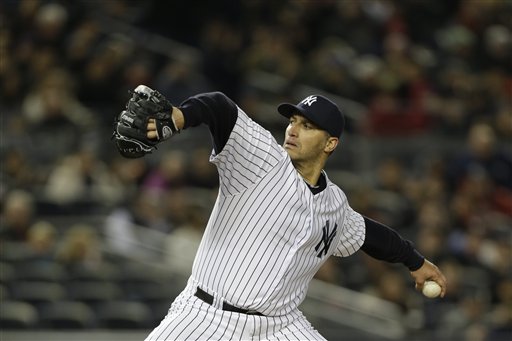 New York Yankees starting pitcher Andy Pettitte winds up against the Boston Red Sox in a baseball game at Yankee Stadium in New York, Thursday, April 4, 2013. (AP Photo/Kathy Willens)