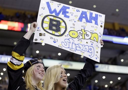 Fans hold up a sign during the second period of an NHL hockey game between the Boston Bruins and the Buffalo Sabres in Boston Wednesday, April 17, 2013. (AP Photo/Elise Amendola) TD Garden