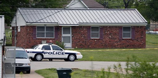 A city of Corinth police car prevents access to a house in Corinth, Miss., on Thursday morning after authorities arrested Paul Kevin Curtis under the suspicion of sending letters covered in ricin to President Barack Obama and others.