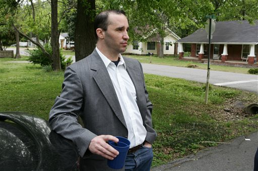 Everett Dutschke stands in the street near his home in Tupelo, Miss., and waits for the FBI to arrive and search his home in this April 23, 2013, photo.