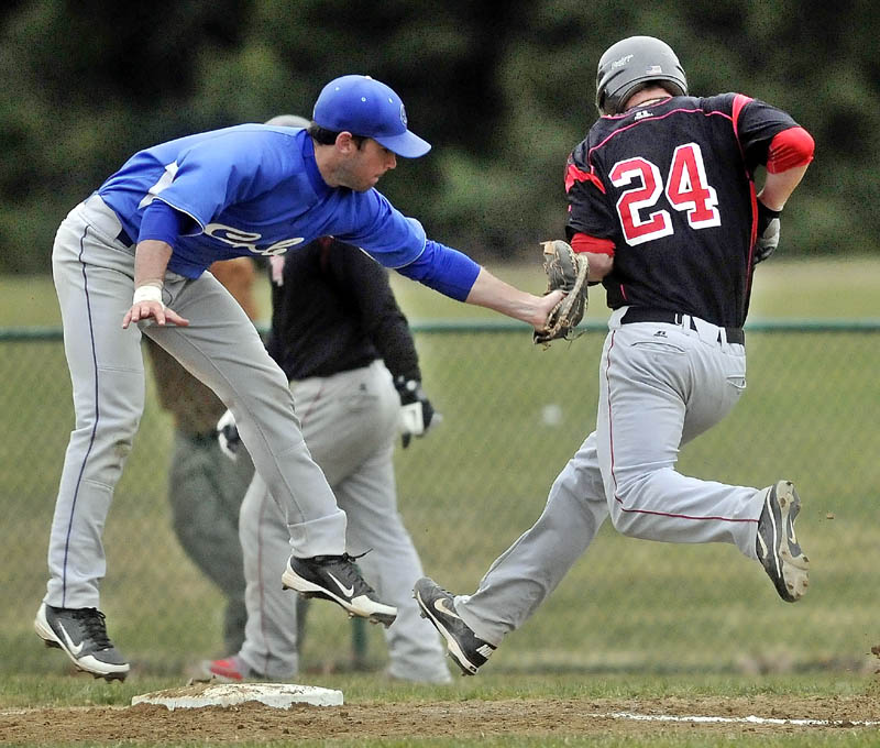 MAKE THE TAG: Colby College first baseman Kevin Galvin, left, tags out Thomas College’s Thomas Cameron after jumping to save the ball from a bad thow in the fourth inning at Thomas College on Tuesday in Waterville.