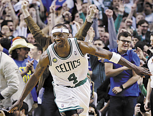 HANGING IN: Boston Celtics guard Jason Terry celebrates his basket against the New York Knicks during overtime of Game 4 of a first-round playoff series Sunday in Boston. Terry scored Boston’s last nine points as they won 97-90.