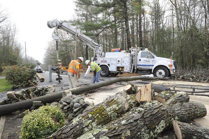 In this Oct. 30, 2012, a FairPoint crew replaces a utility pole in Westbrook after Hurricane Sandy rolled through Maine and caused widespread power outages.