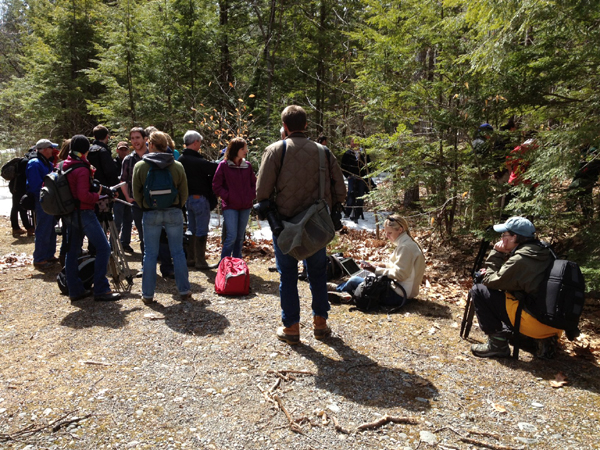 Journalists and neighbors wait to hike into Christopher Knight's camp.