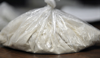 A bag containing more than 100 grams of heroin seized was Tuesday night at a Farmingdale apartment by Kennebec County Sheriff's deputies and agents from the Maine Drug Enforcement and the federal Drug Enforcement Agency.