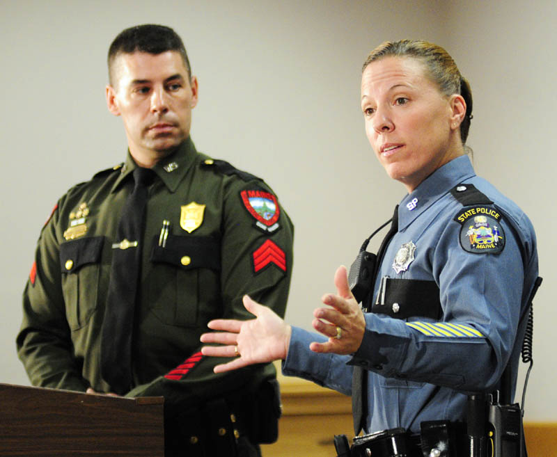 Warden Service Sgt. Terry Hughes, left, and State Police Trooper Diane Perkins-Vance talk about capturing Christopher Knight -- known as the "North Pond Hermit — during a news conference on Wednesday in Augusta.