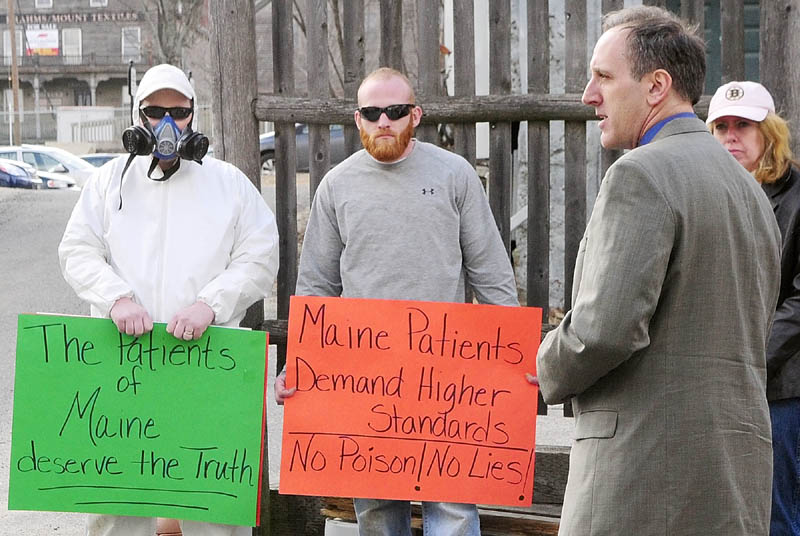 Brian Lee, who said he was a Wellness Connection patient, speaks during a protest on Friday in the middle of Dummers Lane in Hallowell. The Wellness Connection of Maine medical marijuana dispensary patient entrance is off Dummers Lane, which is an alley, next to the Liberal Cup, that runs between Water and Second Streets.