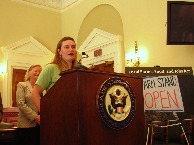 Sarah Smith, co-owner of Grassland Organic Farm in Skowhegan, speaks Tuesday, April 9, 2013 during a press conference in Washington D.C., during which Maine's U.S. Rep. Chellie Pingree (in background) unveiled a bill that aims to expand consumer access to products from local farms.