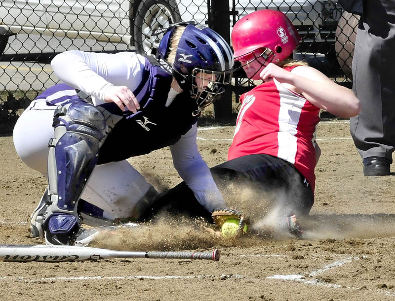 Waterville's catcher Kaitlyn Spalding tags out Camden Hills' Bekah Hilt at home place during the Windjammers' 3-2 win Wednesday in Waterville.