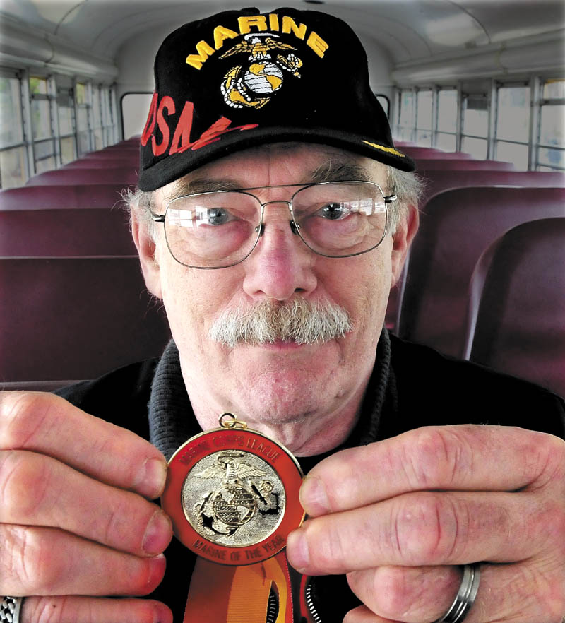 Richard Gordon, of Norridgewock, who served in the U.S. Marine Corp from 1957-1961, holds a metal he received after being named Department of Maine Marine of the Year.