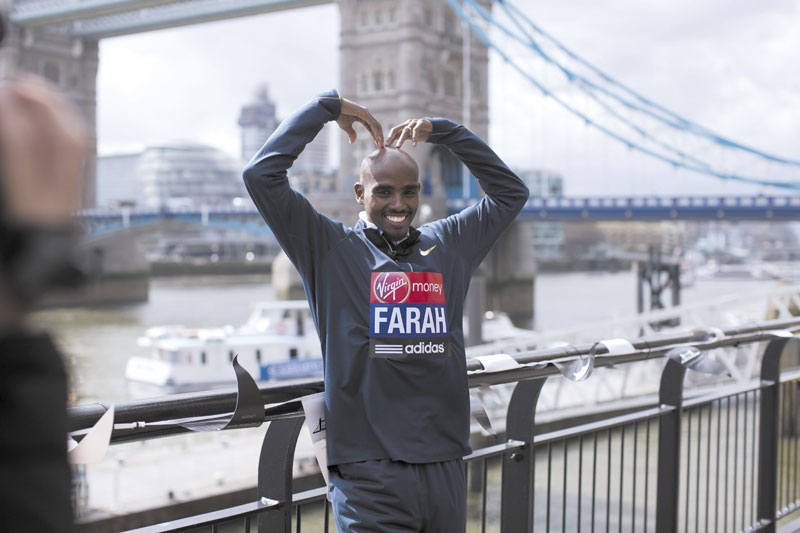 FEELING SAFE: Mo Farah, the reigning Olympic 5,000 and 10,000 meter champion poses for photographers during a media opportunity Thursday for the London Marathon near Tower Bridge in London. Farrah will run the half marathon in London.