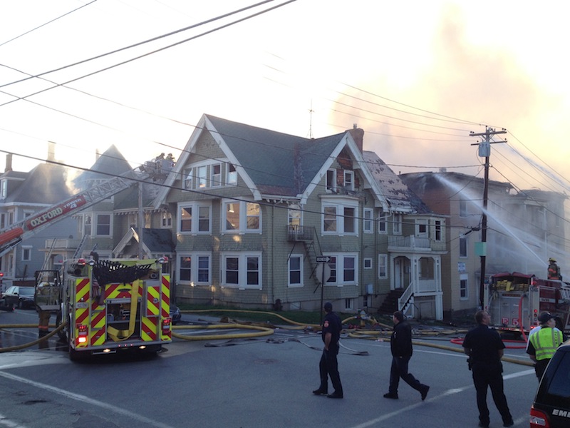 Firefighters battle a blaze in Lewiston on Monday that has consumed multiple buildings.