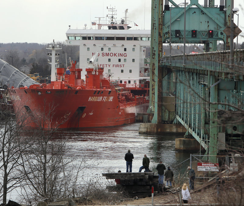 The tanker the Harbour Feature rests against the Sarah Mildred Long Bridge in Kittery where it crashed Monday.