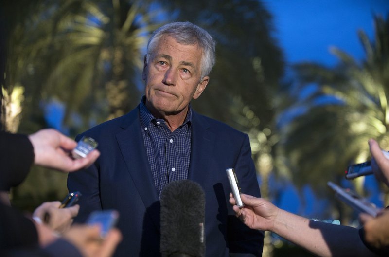 U.S. Secretary of Defense Chuck Hagel speaks with reporters Thursday after reading a statement on chemical weapons use in Syria in Abu Dhabi, United Arab Emirates.