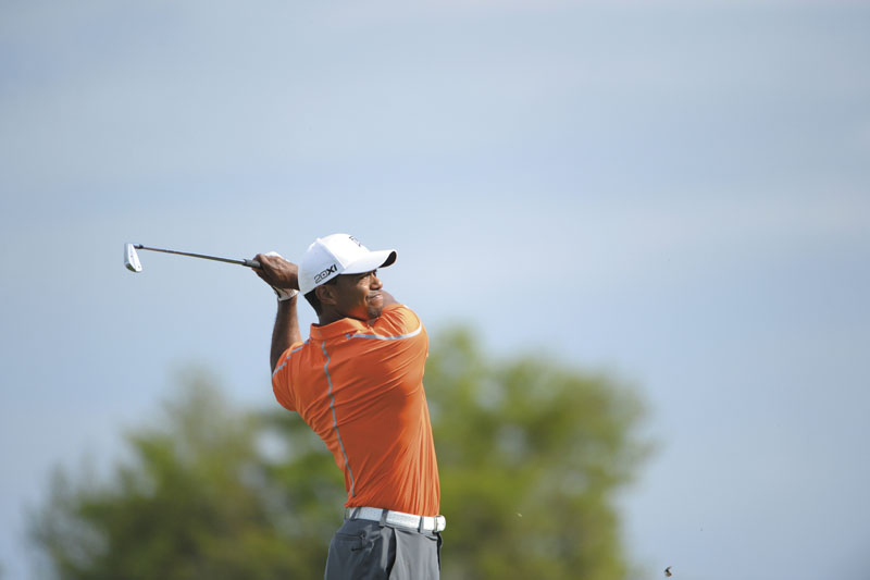 Tiger Woods watches his tee shot on the 14th hole during the second round of the Arnold Palmer Invitational golf tournament in Orlando, Fla., Friday, March 22, 2013.(AP Photo/Phelan M. Ebenhack)