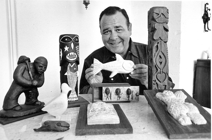Jonathan Winters poses with his carvings and sculptures at his home in Toluca Lake, Calif., in 1966.