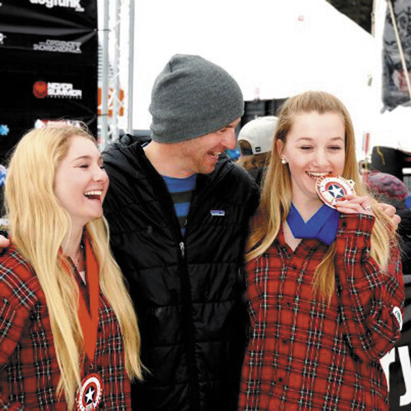 TASTE LIKE GOLD: Abi Zagnoli, right, celebrates with her coach, Mike Mallon , center, and Bianca Marcello after winning the girls 13-15-year-old age group skier-x title at the USASA Ski and Snowboard National Championships on Monday in Cooper Mountain, Colo. Marcello finished second.