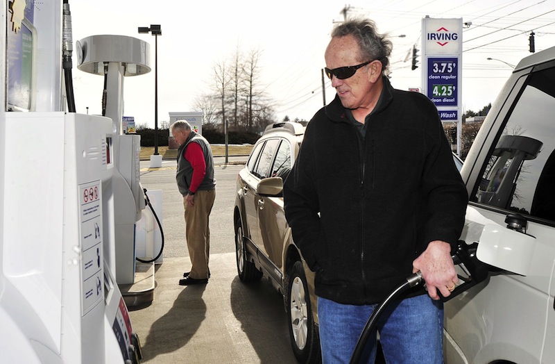 In this February 2012 file photo, Jim Gorman from Cumberland Foreside fills his tank with gas at an Irving Station in Falmouth. State revenue from the gas tax is on the decline, and some lawmakers and transportation advocates say Maine must find new ways to draw revenue to support upkeep of the state's highways.