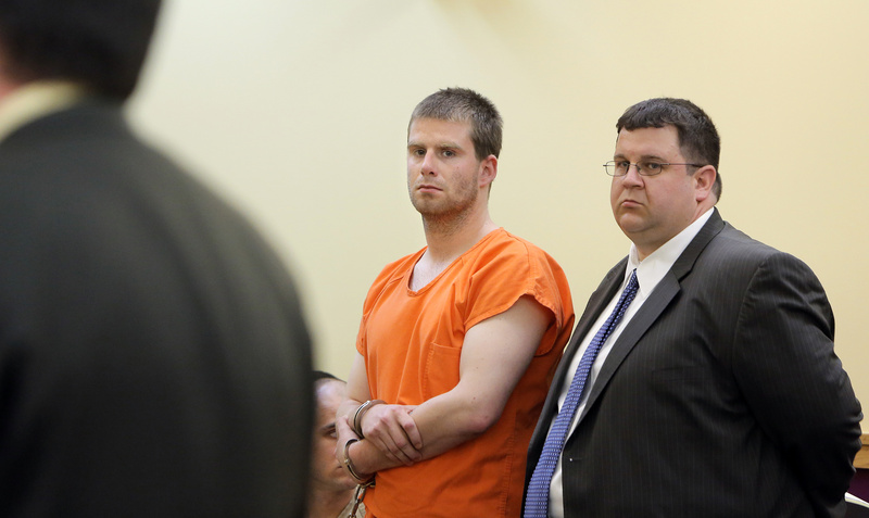 Bryan Wood and his attorney Steven Carey listen to Assistant District Attorney Neil McLean during Wood's arraignment Monday in Lewiston District Court on three counts of arson.