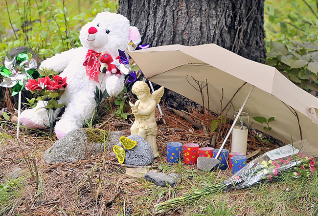 Items of love and remembrance lie at the base of a memorial to Nichol Cable, who was missing for about a week before her body was found in a wooded area in Old Town.