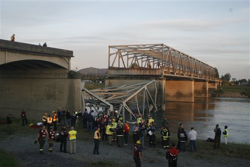 A portion of the Interstate-5 bridge is submerged after it collapsed into the Skagit river dumping vehicles and people into the water in Mount Vernon, Wash., Thursday, May 23, 2013 according to the Washington State Patrol. (AP Photo/Joe Nicholson)