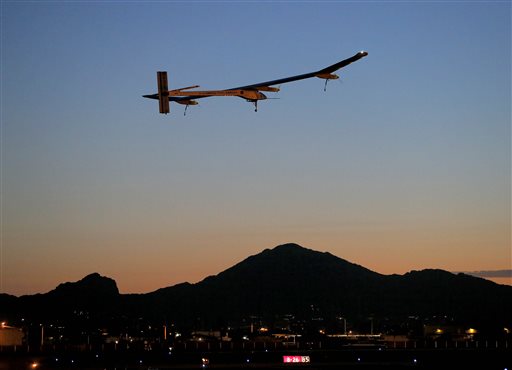Solar Impulse, piloted by Andre Borschberg, takes flight during the second leg of the 2013 Across America mission at dawn Wednesday from Sky Harbor International Airport in Phoenix.