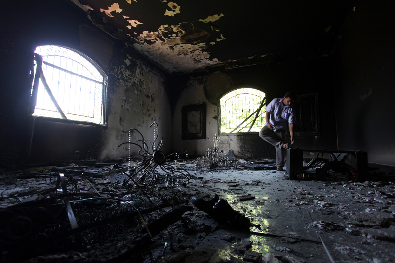 A Libyan man investigates the inside of the U.S. Consulate in September 2012 after an attack that killed four Americans, including Ambassador Chris Stevens, on the night of Sept. 11, 2012, in Benghazi, Libya.