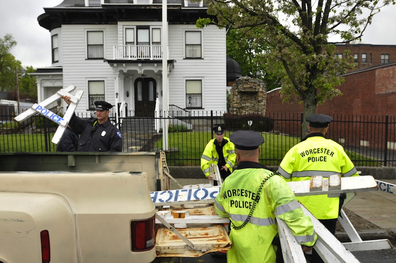 Worcester police remove barricades from in front of the Graham Putnam & Mahoney funeral home in Worcester, Mass., on Thursday, May 9, 2013. Boston Marathon bombing suspect Tamerlan Tsarnaev has been buried in an undisclosed location outside the city of Worcester, police said Thursday after a frustrating weeklong search for a community willing to take the body. Tsarnaev's body had been at the Graham Putnam & Mahoney Funeral Parlors. Sgt. Kerry Hazelhurst said the body was no longer in Worcester and is now entombed. Police did not specify where the body was taken. (AP Photo/Worcester Telegram & Gazette, Paul Kapteyn)