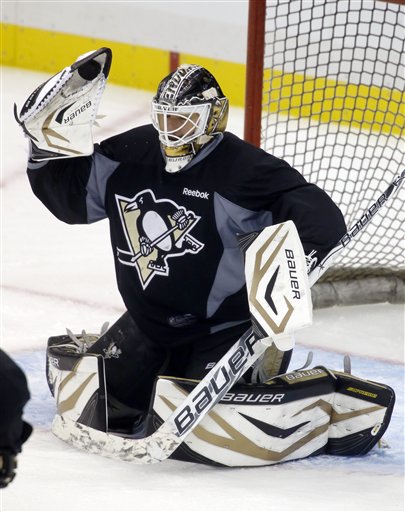 Pittsburgh Penguins goalie Tomas Vokoun stops a shot during the NHL hockey practice on Friday, May 31, 2013 in Pittsburgh. The Penguins are preparing for the Stanley Cup Playoff series against the Boston Bruins scheduled to start in Pittsburgh on Saturday.