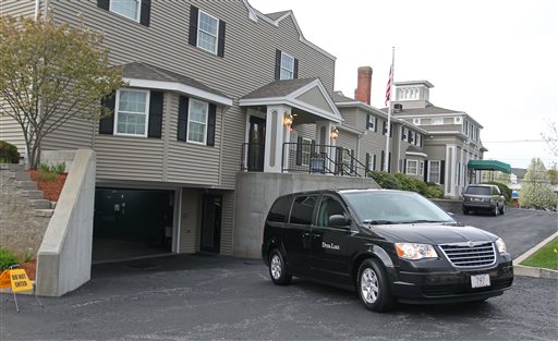 A vehicle believed to be carrying the body of Boston Marathon bombing suspect Tamerlan Tsarnaev backs into an underground garage at the Dyer-Lake Funeral Home in North Attleborough, Mass., on Thursday.