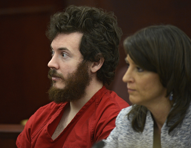 James Holmes, who is accused of opening fire in a Colorado movie theater, sits next to defense attorney Tamara Brady in district court in Centennial, Colo., on March 12.