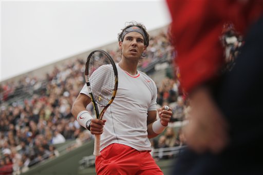 Spain's Rafael Nadal clenches his fist after scoring a point against Slovakia's Martin Klizan in their second round match at the French Open tennis tournament, at Roland Garros stadium in Paris, Friday, May 31, 2013. Nadal won in four sets 4-6, 6-3, 6-3, 6-3.