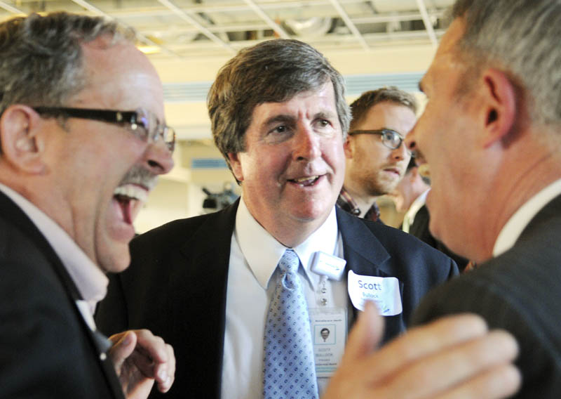 Norm Elvin, left, and Mark Johnston, right, congratulate former MaineGeneral CEO Scott Bullock, center, after a building of the new hospital campus was named in his honor on Tuesday at a ceremony in Augusta. The Scott B. Bullock Medical Office Building will be part of the new, regional hospital.