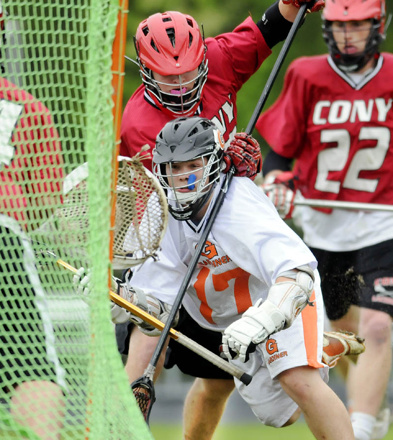 TAKING THE SHOT: Gardiner Area High School’s Dalton Sargent takes a shot during the Tigers’ 12-3 win over Cony in boys lacrosse action Wednesday in Gardiner.