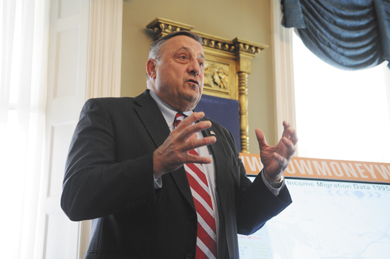 Gov. Paul LePage speaks at the Blaine House on Monday. Missouri lobbyist Travis Brown presented demographics from the U.S. Census Bureau and income information from the Internal Revenue Service. LePage then took questions.