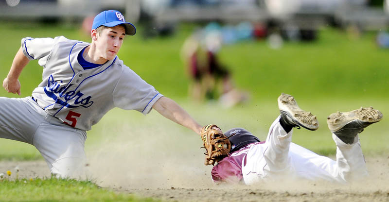 YOU’RE OUT: Monmouth Academy’s Devin West gets tagged out at second base by Oak Hill High School’s Brady Dion on Tuesday in Monmouth.