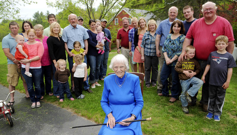 Priscilla Stevenson, 95, is surrounded by three generations of her children outside her Wayne home, after she received the Wayne Cane Sunday, given to the town's oldest resident.