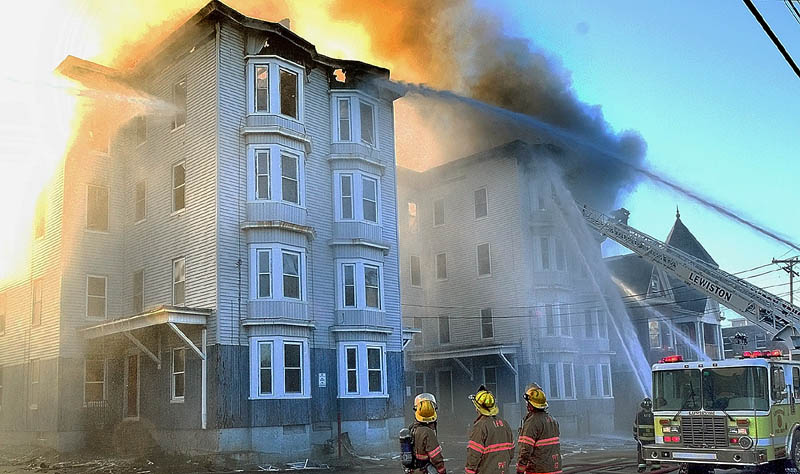 Firefighters battle the third major fire in a week, this one at 114-118 Bartlett Street in Lewiston, reported about 3 a.m. on Monday. Authorities say more than 100 firefighters responded to the scene of the third major apartment fire in Lewiston in a week.