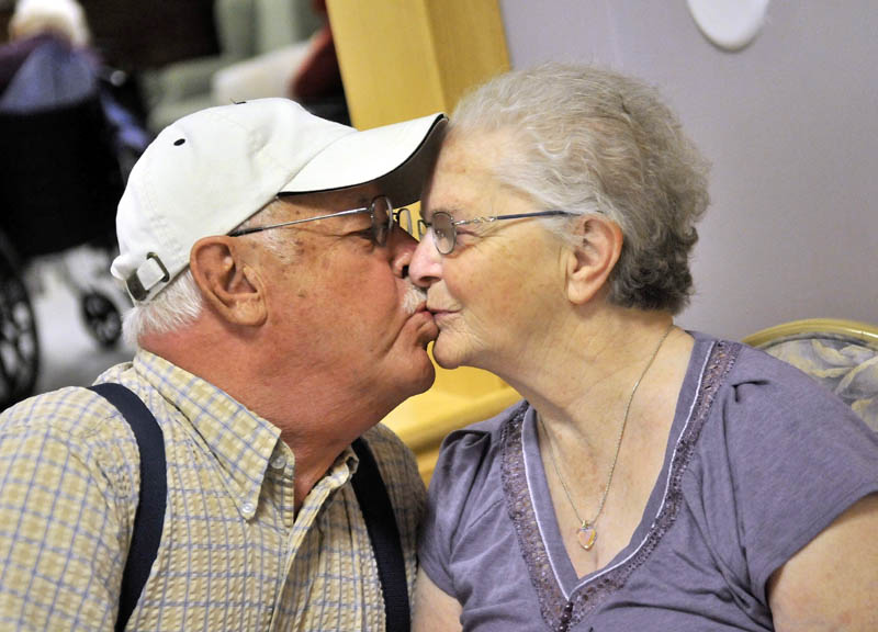 Jake Ellis kisses his wife of 62 years, Pauline Ellis, at Lakewood Nursing Home, a ritual he says he never misses. Jake has seen a great improvement in his wife's mood and happiness since being taken off of her antipsychotic medication.