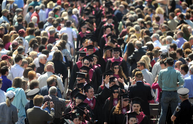 University of Maine at Farmington graduates march to their seats during commencement ceremonies in Farmington on Saturday.