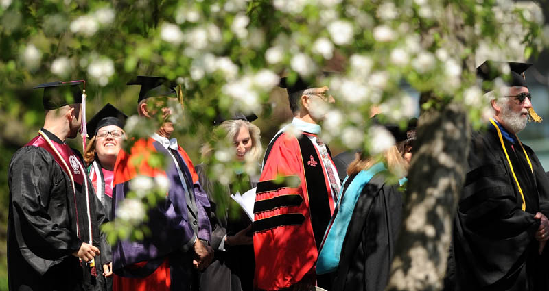 aculty and staff of the University of Maine at Farmington lead the procession during commencement ceremonies in Farmington on Saturday.
