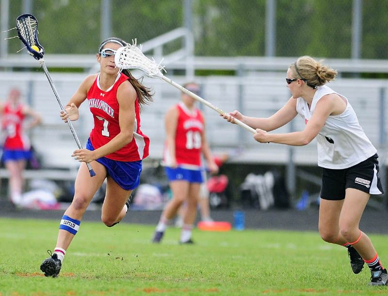 VISION TROUBLE: Messalonskee’s Kristy Bernatchez, left, tries to get past Gardiner’s Emma Hickey on Thursday at Hoch Field in Gardiner. The Eagles beat the Tigers 17-9.