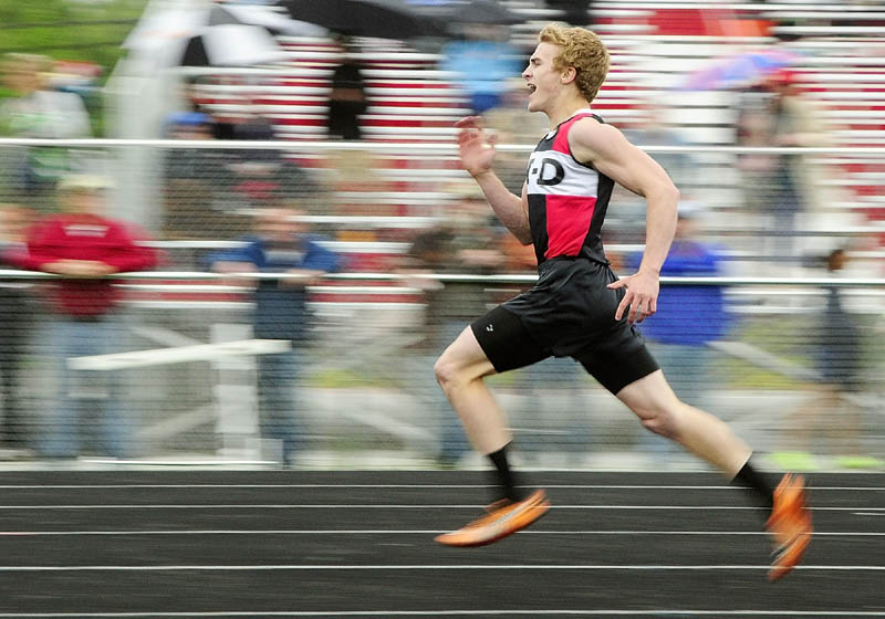 Staff photo by Joe Phelan TOTAL BLUR: Hall-Dale’s Tyler Fitzgerald runs the 200-meter dash during Mountain Valley Conference track and field championship at Cony’s Alumni Field in Augusta.