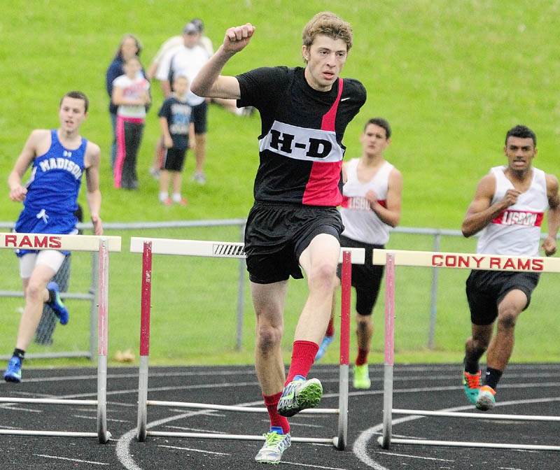 FULL SPRINT: Hall-Dale hurdler Sam Shepherd runs the 300 meter hurdles during Mountain Valley Conference track and field championship Thursday at Alumni Field in Augusta.