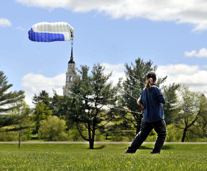 Dan LaRochelle, of Waterville, takes advantage of the blustery weather with his 9-foot quad-line kite on the fields at Colby College on Friday.