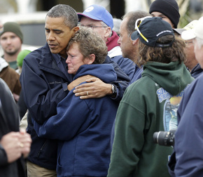 In this October 31, 2012 file photo, President Obama embraces Donna VanzantI during a tour of a Brigantine, N.J., a neighborhood decimated by superstorm Sandy. When President Barack Obama travels to Oklahoma on Sunday to meet with the survivors of Monday's tornado, it will mark the third time this year that he has journeyed to a patch of America to console a community on behalf of the country.