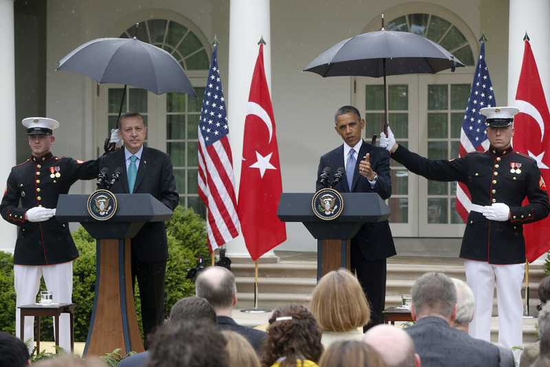 Marines hold umbrellas as President Obama and Turkish Prime Minister Recep Tayyip Erdogan participate in a joint news conference in the Rose Garden of the White House in Washington on Thursday.
